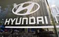 韩国现代汽车公司（Hyundai Motor Co.）及其公司标志（图片来源：JUNG YEON-JE/AFP via Getty Images）
