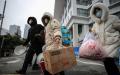 武汉肺炎患者于2020年3月9日离开武汉市的一家临时医院。（图片来源:Getty Images）