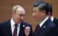9月16日，俄罗斯总统普京与习近平在上合峰会上交谈。（图片来源：SERGEI BOBYLYOV/SPUTNIK/AFP via Getty Images）