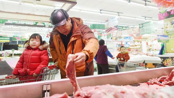 大陆肉价持续上涨，不少地区已出现猪肉限价、限量供应的情况。（Getty Images）