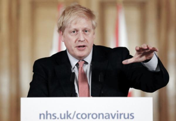 英国政府声明，首相约翰逊已被确诊感染武汉肺炎病毒。图为约翰逊在新闻发布会上讲述如何应对疫情。（Getty Images）
