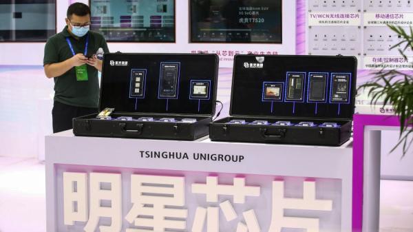 近期中国芯片巨头纷纷落马，芯片企业接连烂尾，一时风声鹤唳。（图片来源：STR/AFP via Getty Images）