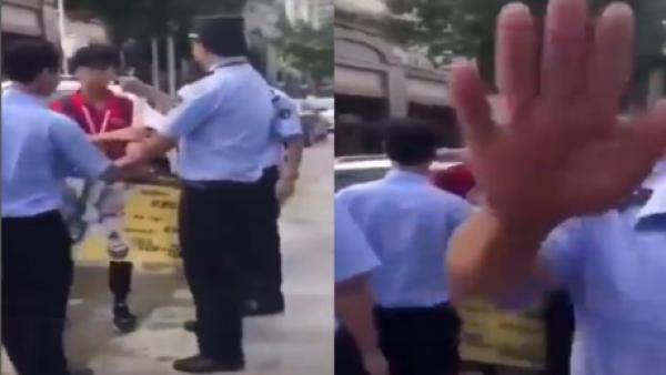 安徽芜湖一贫困大学生摆地摊赚学费遭城管殴打，还禁止拍照。（图片来源：视频截图）