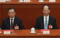 2025年3月11日，在中共全国人民代表大会闭幕式现场。图为时任中组部长李干杰（左）和时任统战部部长石泰峰（右）。