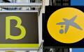 Bankia和CaixaBank两家银行的logo（GABRIEL BOUYS/AFP via Getty Images）
