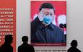 抗疫展览中的习近平照片（图片来源：NICOLAS ASFOURI/AFP via Getty Images）