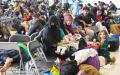 9月8日，阿富汗难民正在德国拉姆施泰因空军基地的5号机库内接受处理。（OLIVIER DOULIERY/POOL/AFP via Getty Images）