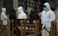 首都北京多家超市24日出现抢购。 （图片来源：HECTOR RETAMAL/AFP via Getty Images）