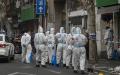 2022年3月14日，上海的警察针对Covid-19展开监控行动。（Hector Retamal/AFP via Getty Images）