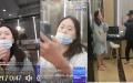 江西南昌女孩李宜雪被多名热心网友在一家宾馆找到，数十名便衣看守。（图片来源：视频截图）