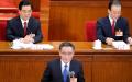 2011年3月5日，全国人大委员长吴邦国（中），中国国家主席胡锦涛（左）和国务院总理温家宝（右）在北京人民大会堂举行的全国人民代表大会开幕式上。（图片来源：LIU JIN/AFP via Getty Images）