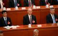 中共全国政协主席王沪宁，政治局常委蔡奇、李希在北京人民大会堂出席全国人民代表大会第四次全体会议。（图片来源：GREG BAKER/POOL/AFP via Getty Images）