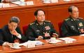 2025年3月5日，军委副主席张又侠（中）、何卫东（右）出席在北京人民大会堂举行的全国人民代表大会开幕会议。（图片来源：ADEK BERRY/AFP via Getty Images）