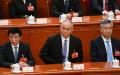 2023年3月12日，全国政协主席王沪宁5（左），政治局常委蔡奇（中）、李希（you）在北京人民大会堂出席全国人民代表大会第五次全体会议。（图片来源：NOEL CELIS/AFP via Getty Images）