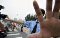 2008年8月13日，北京警方封锁一个公园后阻止摄影记者拍照。示意图（图片来源：JEWEL SAMADAFP via Getty Images）