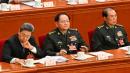 2025年3月5日，军委副主席张又侠（中）、何卫东（右）出席在北京人民大会堂举行的全国人民代表大会开幕会议。（图片来源：ADEK BERRY/AFP via Getty Images）