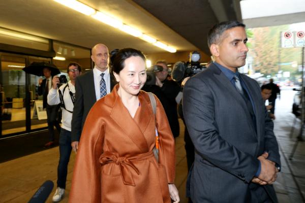 孟晚舟多次身穿名牌出庭。(图片来源:Photo by Karen Ducey/Getty Images)