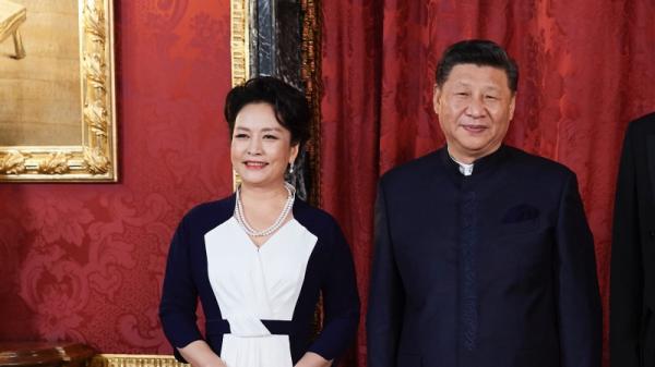习近平和彭丽媛（图片来源: Photo by Carlos Alvarez/Getty Images）