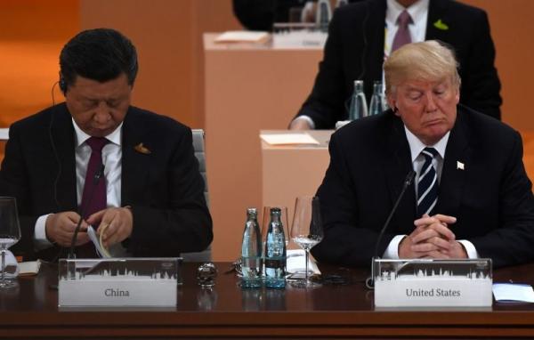 2017年7月7日至8日,川普与习近平参加在德国举行的G20峰会。(图片来源:PATRIK STOLLARZ / AFP / Getty Images)