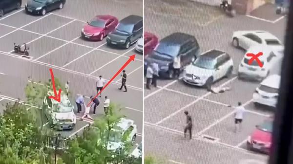 两名男子将受害女拖走,试图借此避难一劫。(图片来源:视频截图)