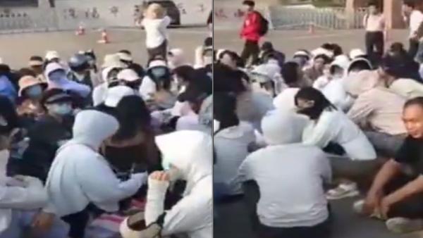 河南洛阳一高、二高教师们罢课集体讨薪、静坐抗议。(图片来源:视频截图)