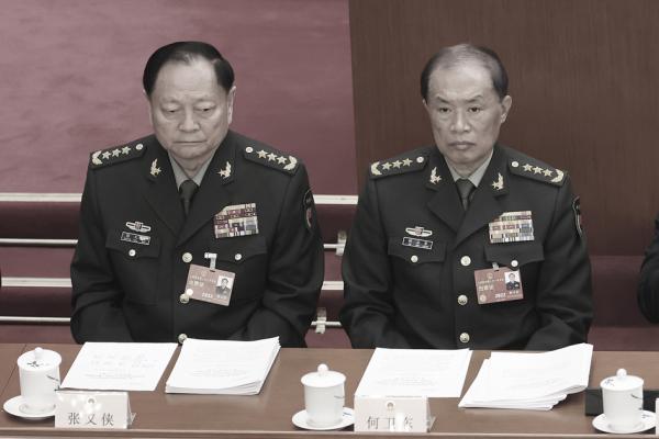 张又侠与何卫东(Lintao Zhang/Getty Images)