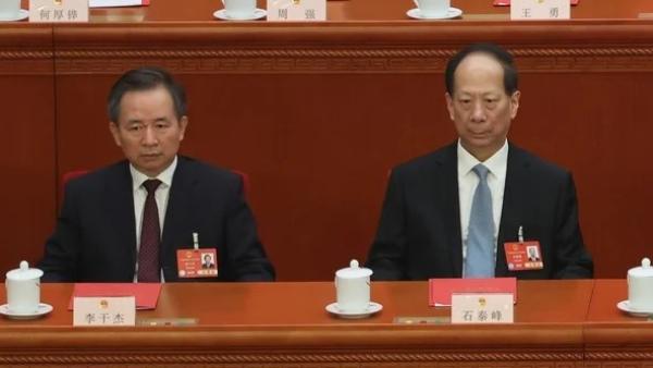2025年3月11日，中共全国人民代表大会闭幕式现场。图为时任中共中组部部长李干杰和中共统战部部长石泰峰。    （图片来源：Lintao Zhang/Getty Images）